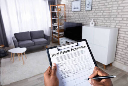 Real estate appraiser with a clipboard