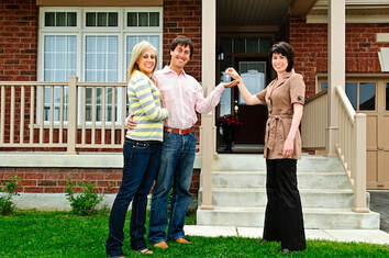 Young couple getting keys to home
