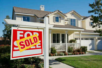 Sold Sign on Home
